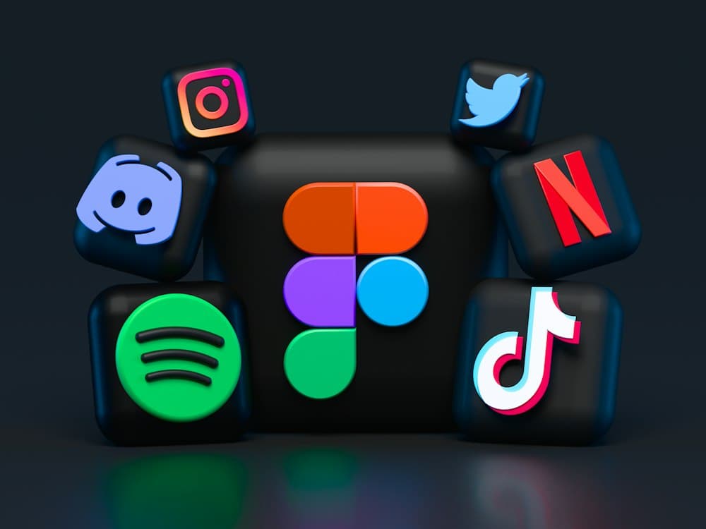 Social media app icons floating above a phone